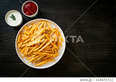 French fries with sour cream and ketchup French fries with sour cream and ketchup 116873711