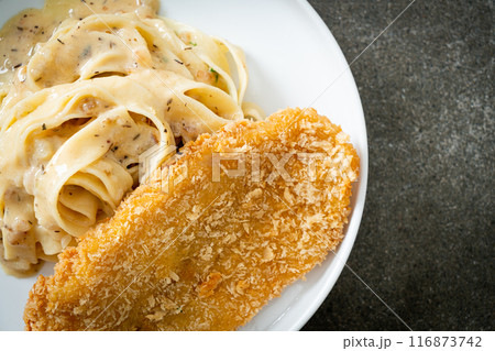 fettuccine pasta white cream sauce with fried fish fettuccine pasta white cream sauce with fried fish 116873742