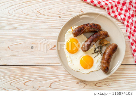 double fried egg with pork sausage double fried egg with pork sausage 116874108