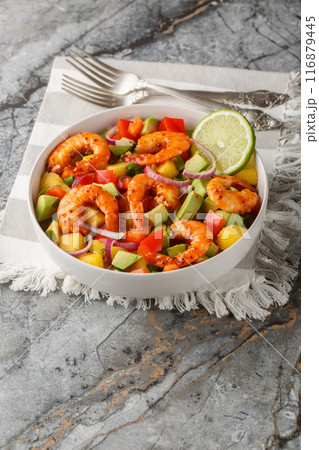 Shrimp Salad with Mango, Avocado, red onion, bell pepper with lime dressing closeup on the bowl. Vertical Shrimp Salad with Mango, Avocado, red onion, bell pepper with lime dressing closeup on the bowl. Vertical 116879445