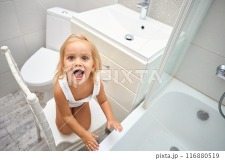 smiling little child in the bathroom 116880519