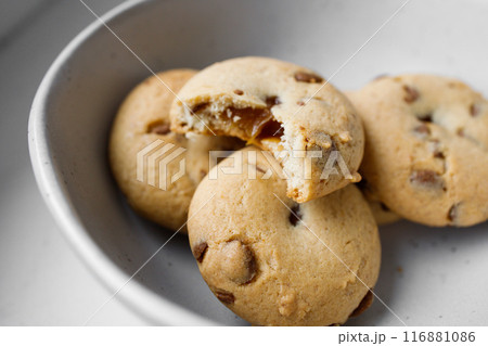 American Twix soft cookies with chocolate and caramel drops in white bowl 116881086