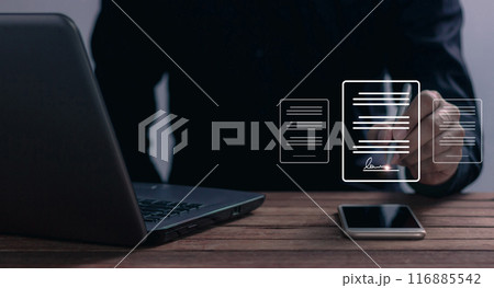Young man uses a smartphone and computer to sign a business contract online 116885542