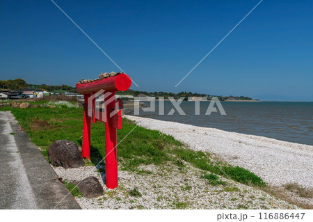 Small red torii gate by Ariake sea and blue sky at Oouo Shrine, Tara Small red torii gate by Ariake sea and blue sky at Oouo Shrine, Tara 116886447
