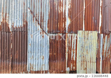Old rusty zinc sheet wall or aged rust iron barn background Old rusty zinc sheet wall or aged rust iron barn background 116886448