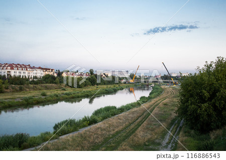 Process of building a new bridge through Warta river in Poznan, Poland Process of building a new bridge through Warta river in Poznan, Poland 116886543