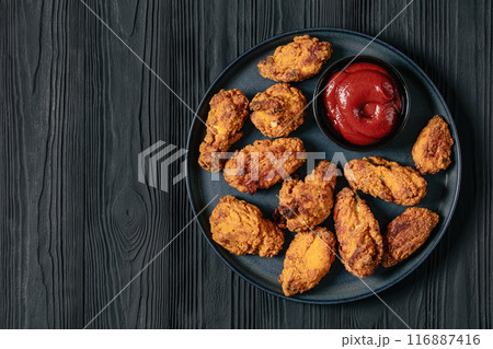 american style fried chicken wings on a plate american style fried chicken wings on a plate 116887416