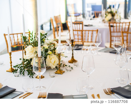 Luxury elegant wedding reception table arrangement and floral centerpiece - wedding banquet and event outdoor Luxury elegant wedding reception table arrangement and floral centerpiece - wedding banquet and event outdoor 116887708