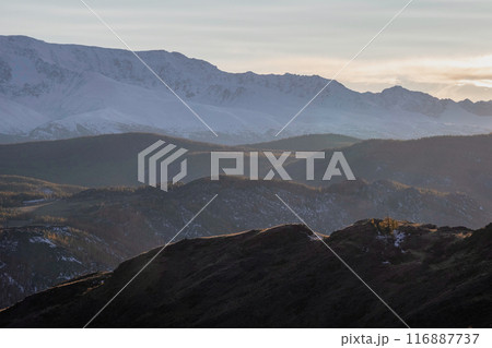 Silhouette of the evening mountains at sunset. Silhouette of the evening mountains at sunset. 116887737