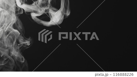 closeup vapor rises from bottom on black background 116888226