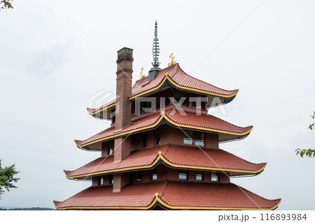 Overview of an Asian Pagoda looking over a forest and city. Overview of an Asian Pagoda looking over a forest and city. 116893984