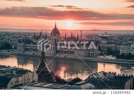 The Hungarian Parliament on the Danube River at dramatic Sunrise in Budapest The Hungarian Parliament on the Danube River at dramatic Sunrise in Budapest 116895492