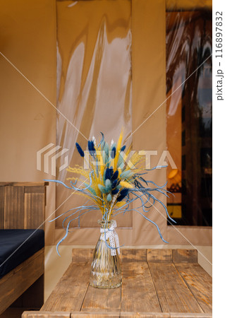 Interior of cozy open glamping tent. Camping tent for outdoor summer holiday and vacation Interior of cozy open glamping tent. Camping tent for outdoor summer holiday and vacation 116897832