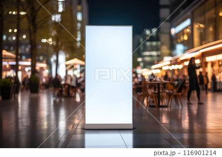 Vertical blank white advertising billboard on the evening street, banner frame for advertisement and information 116901214