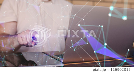 Businessman using laptop with abstract network hologram in office. Double exposure Businessman using laptop with abstract network hologram in office. Double exposure 116902015
