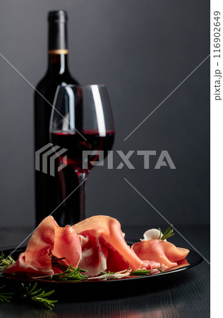 Prosciutto with rosemary and red wine. 116902649