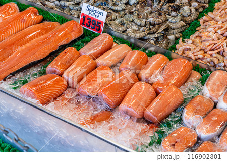 Fresh salmon fillets on fish stand in fish market at the Wharf Washington D.C Fresh salmon fillets on fish stand in fish market at the Wharf Washington D.C 116902801