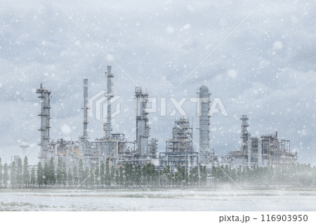 An old oil refinery in north pole snow tundra grass field snowstorm. Oil and Gas Energy power production in Siberia winter season. 116903950