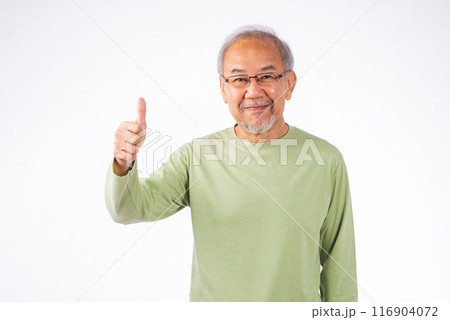 Portrait Asian senior man with glasses and a green shirt is giving a thumbs up studio shot isolated on white background. Concept of approval and positivity, old man smiling 116904072