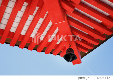 Elements of the red roof of a Japanese temple are red against 116904412