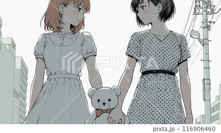 LGBT：女同士のカップルが仲良く手をつないで歩いている