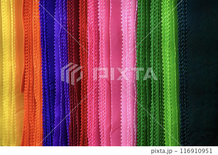 Close up scene the colorful strip of cloth. 116910951