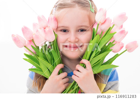 Cheerful beatiful little girl with a armful of colorful flowers, on white background Cheerful beatiful little girl with a armful of colorful flowers, on white background 116911283