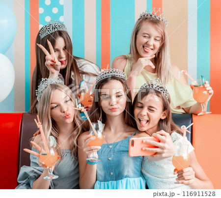 Funny girls taking selfie at birthday celebration 116911528