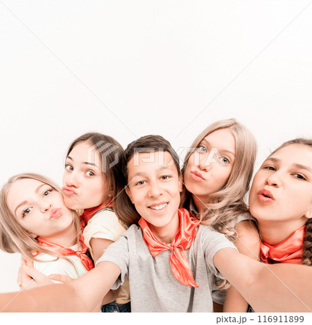 teenage smiling boy making selfie with cute funny girls teenage smiling boy making selfie with cute funny girls 116911899