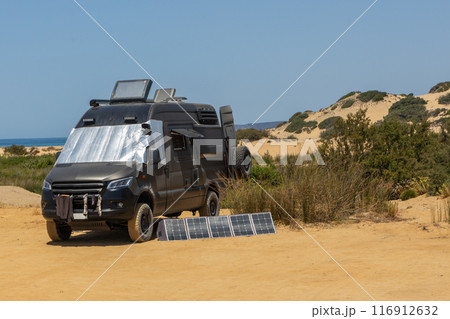Black Camper Van with Solar Panels Setup 116912632