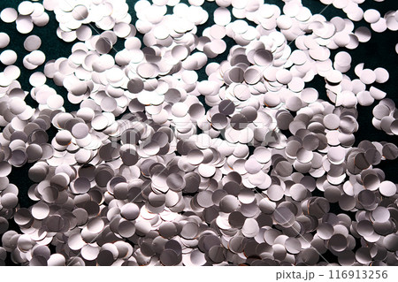 Green Christmas background with confetti. Green Christmas background with confetti. 116913256