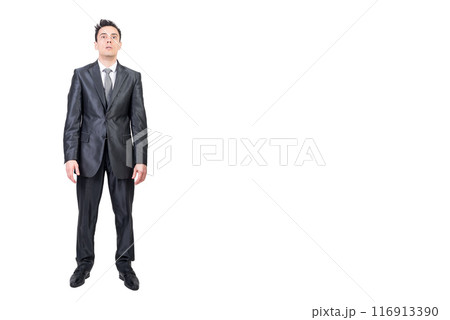 Shocked businessman in suit in studio. White background. Shocked businessman in suit in studio. White background. 116913390