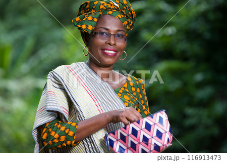 close up of young african woman, happy. 116913473