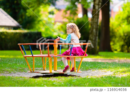 Kids explore nature. Children play in sunny park. 116914036
