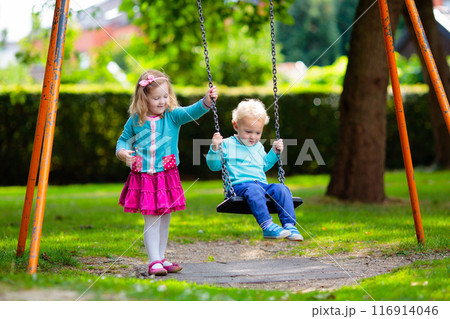 Kids explore nature. Children play in sunny park. Kids explore nature. Children play in sunny park. 116914046