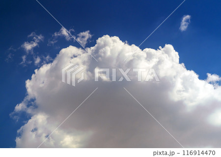 A large, slightly blurred white cloud with soft light shadows against a blue sky. Blank for artwork as a storm and rain are approaching, the threat of a downpour hangs over your head soon A large, slightly blurred white cloud with soft light shadows against a blue sky. Blank for artwork as a storm and rain are approaching, the threat of a downpour hangs over your head soon 116914470