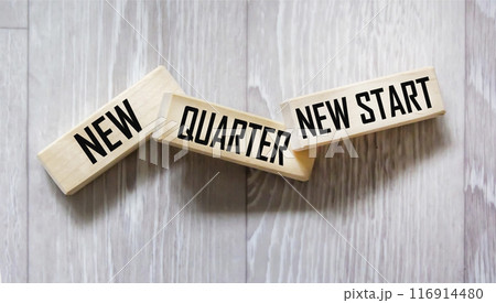 On wooden blocks the text NEW QUARTER, NEW START 116914480