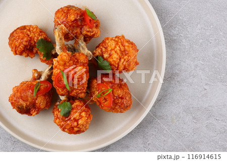 Grilled chicken wings with vegetable and spices flat lay on white background, food ideas concept Grilled chicken wings with vegetable and spices flat lay on white background, food ideas concept 116914615