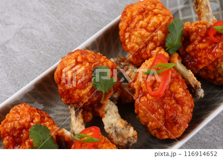 Grilled chicken wings with vegetable and spices flat lay on white background, food ideas concept Grilled chicken wings with vegetable and spices flat lay on white background, food ideas concept 116914652