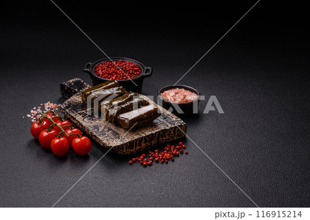 Delicious dolma in the form of rice and meat wrapped in grape leaves 116915214
