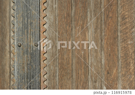 Antique doors with metal elements. Fragment of an old door 116915978