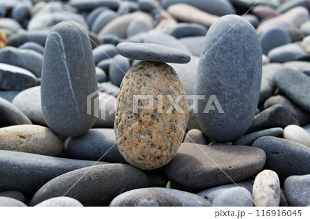 Pebbles of different colors on a rocky beach. Pebbles of different colors on a rocky beach. 116916045