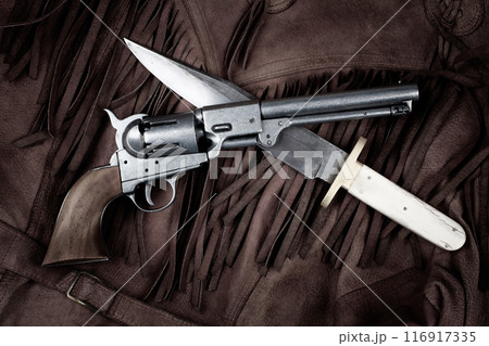 Revolver with bowie knife on leather jacket Revolver with bowie knife on leather jacket 116917335