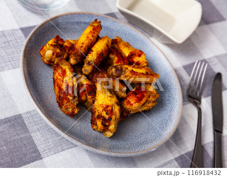 Appetizing baked chicken wings 116918432