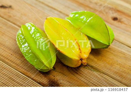 Juicy cannon fruits on a wooden desk in kitchen 116918437