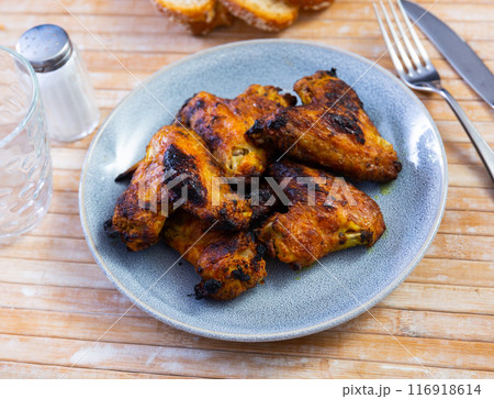 Appetizing baked chicken wings Appetizing baked chicken wings 116918614