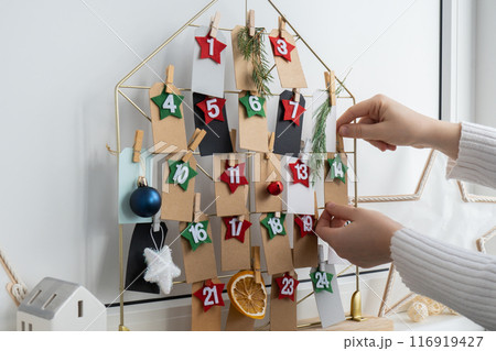 Step by step instruction of making handmade Christmas advent calendar. Creative craft homemade decor. New year celebration. Winter Step by step instruction of making handmade Christmas advent calendar. Creative craft homemade decor. New year celebration. Winter 116919427