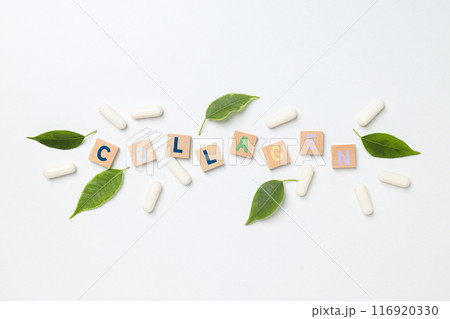 Inscription collagen on wooden cubes with leaves and pills Inscription collagen on wooden cubes with leaves and pills 116920330