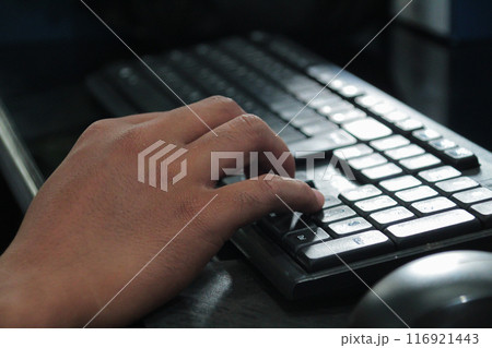 Hands of an office man typing 116921443