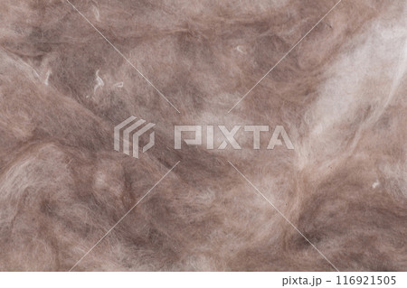 Construction worker thermally insulating house mineral wool attic with glass wool 116921505